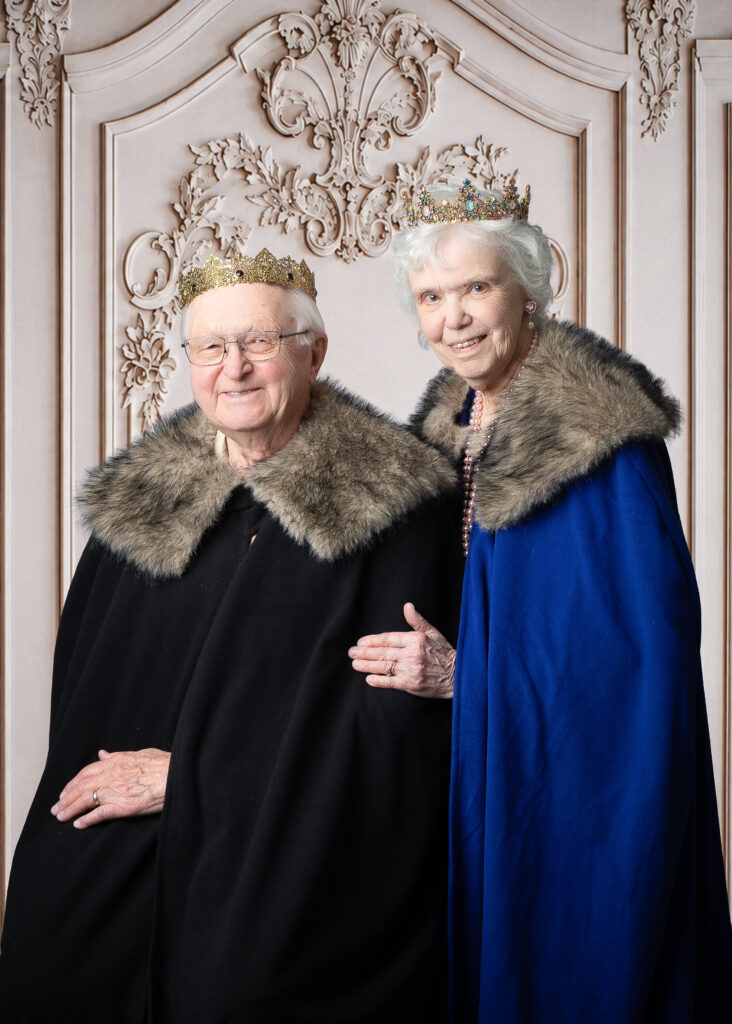 Senior couple posing for professional portraits at Smithfield Lodge.