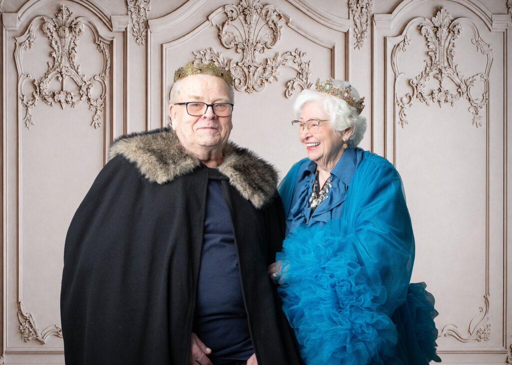 Senior couple posing for professional portraits at Smithfield Lodge.